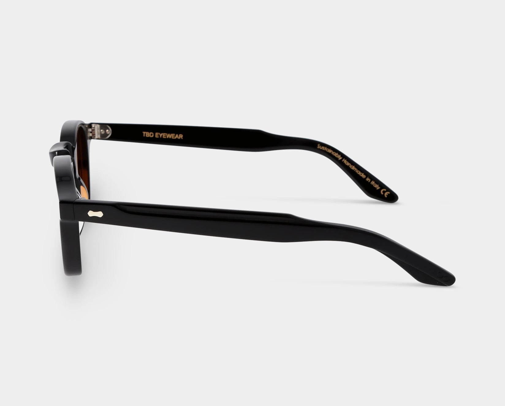 Black sunglasses with orange lenses: Cord   TBD Eyewear