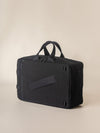 A trendy men's overnight travel bag with a modern design and convenient side pockets